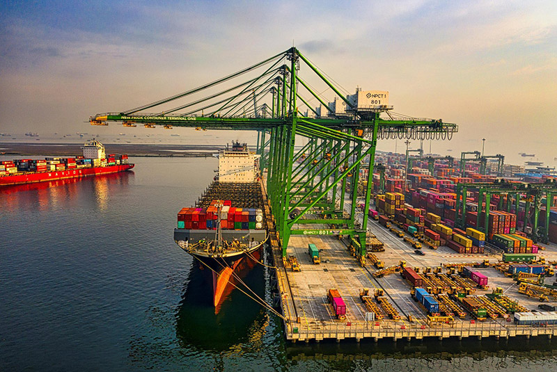Container ship at a port terminal for international trade coordination