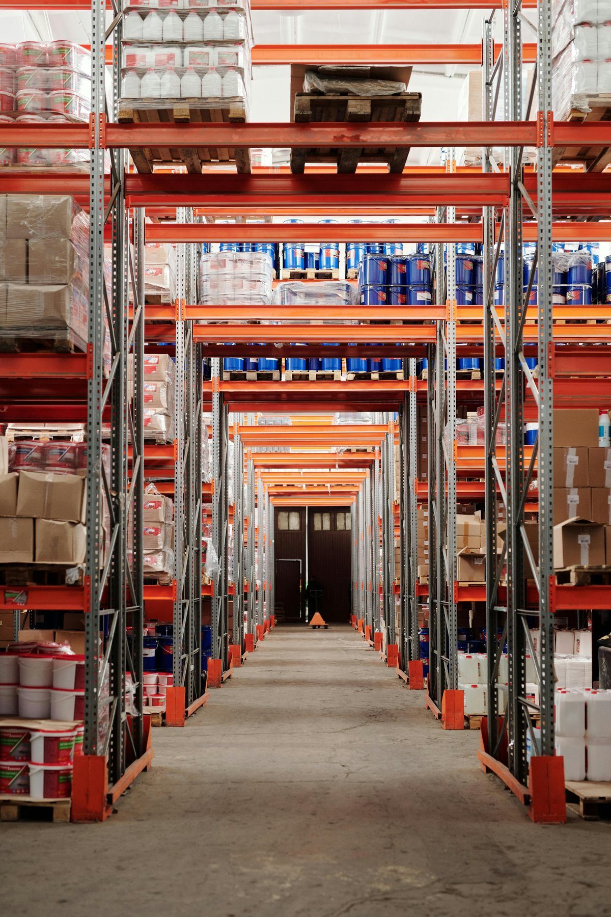 Warehouse shelving with commercial goods for supply coordination